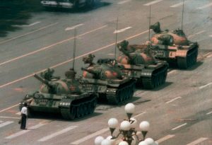 iconic photo of man standing in front of tanks tianenmen square