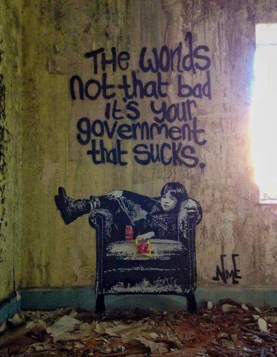 The world's not all that bad, it's your government that sucks. Banksy graffiti in destroyed home.